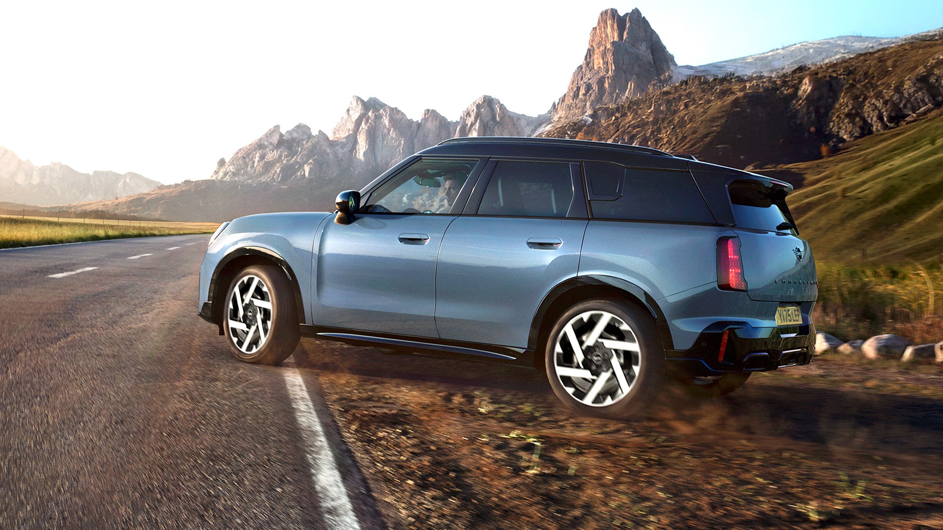 Top view of the MINI Countryman in Smokey Green with with contrast roof and big glass roof.